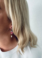Oorbellen met goud en roze vis
