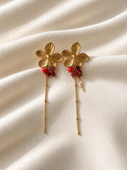 Oorbellen Lang met Gouden Bloem en rode details